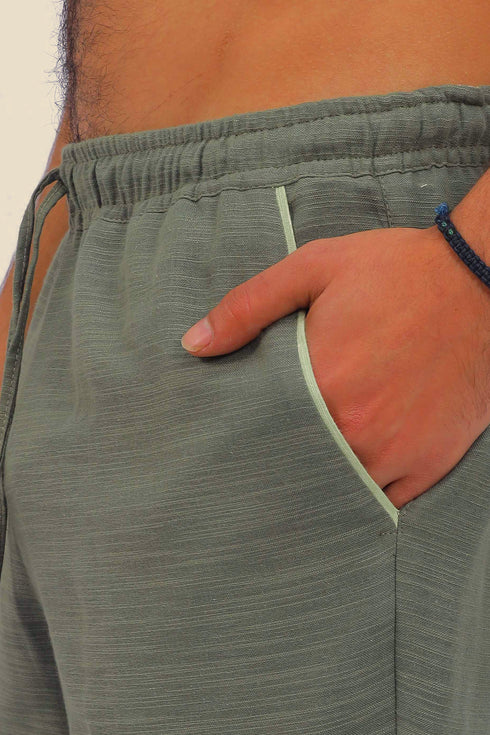 Straight leg cotton pants with elastic waistline and pockets